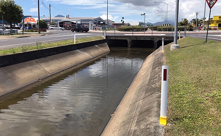 Delineator post installed next to a river