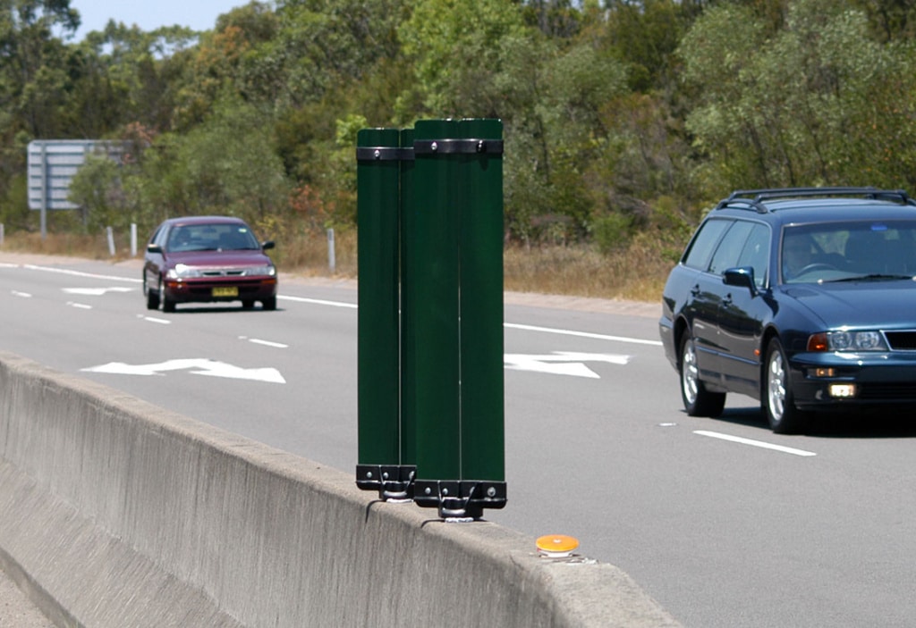Tw0 Green Glareflex posts on a highway
