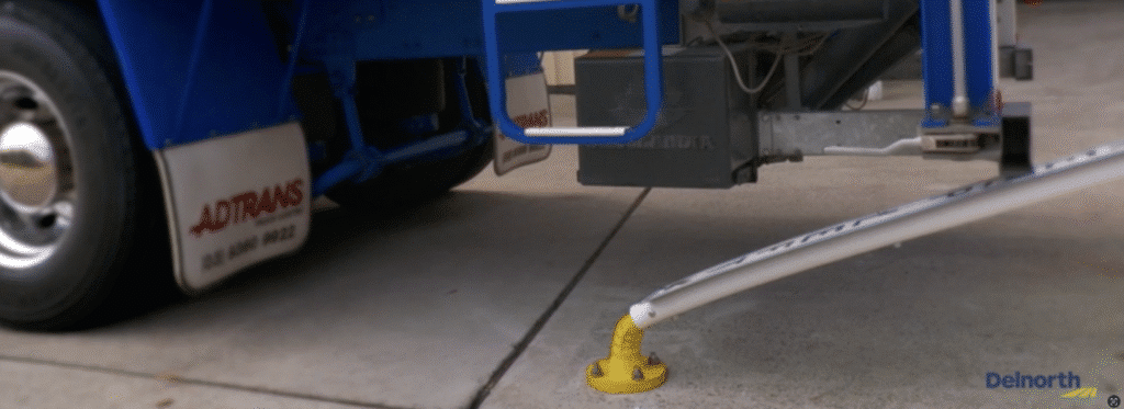 A flexible sign post under a truck