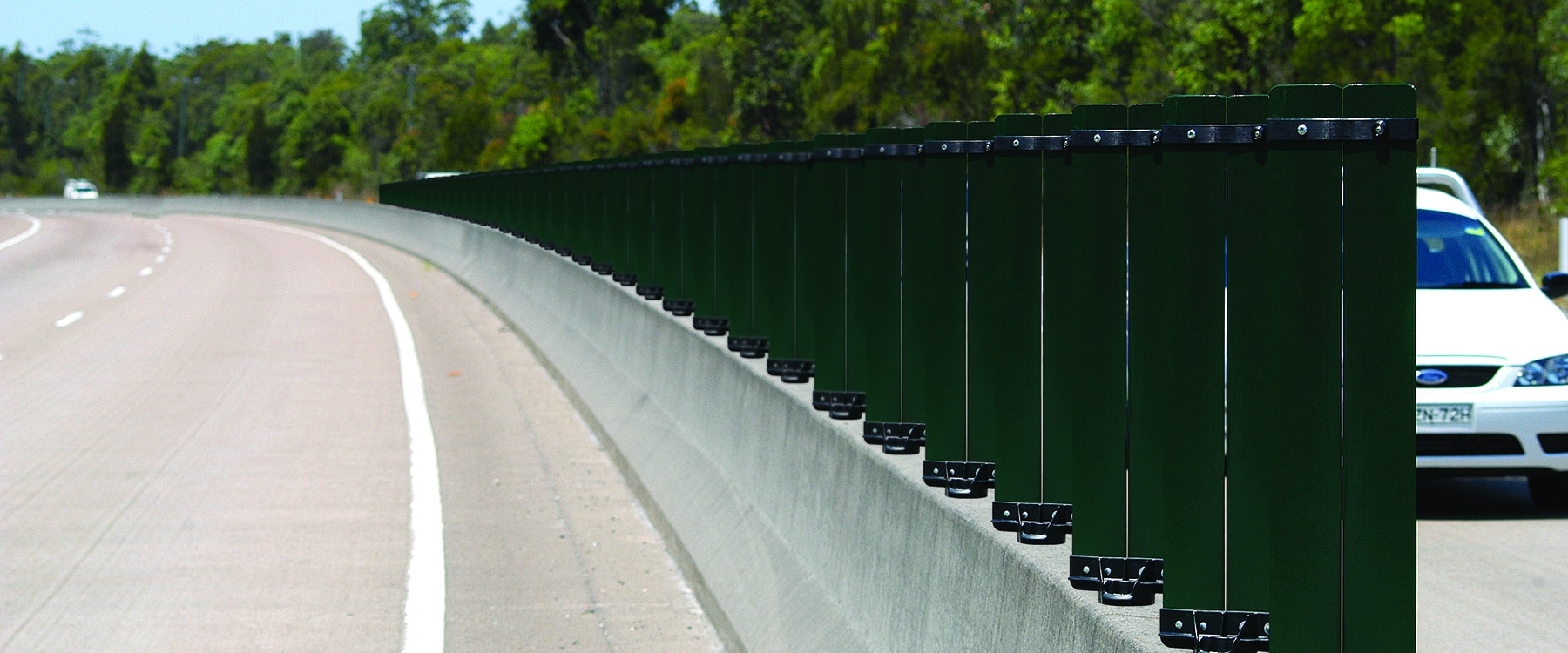 Green Glareflex posts on a road in Australia