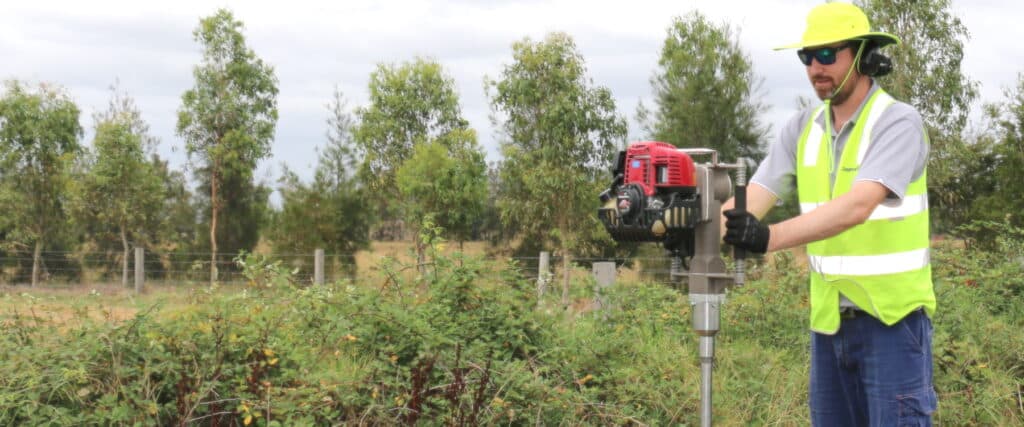 A construction worker using a power tool