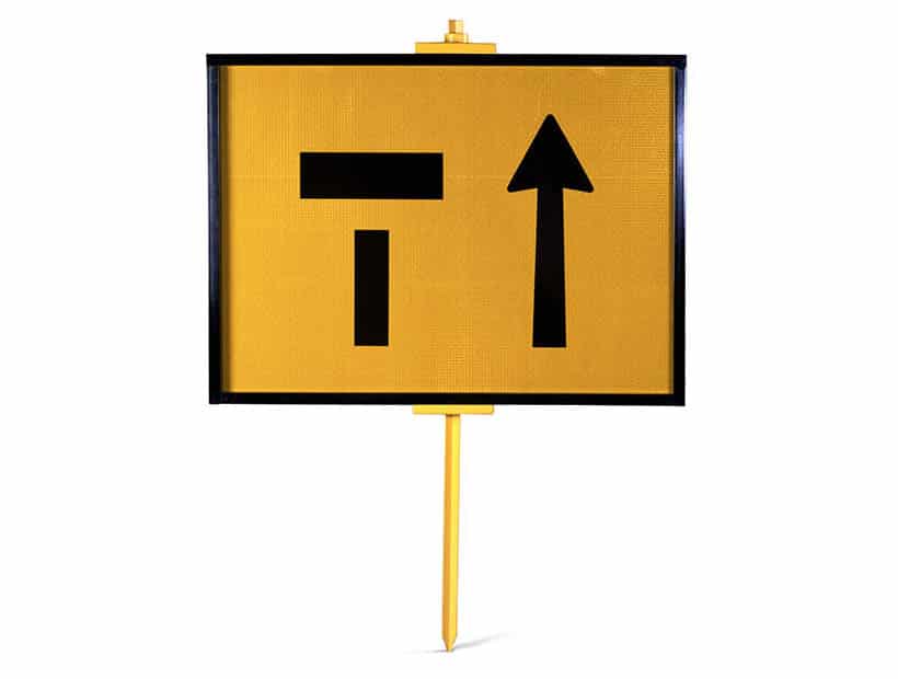 A yellow closed road sign