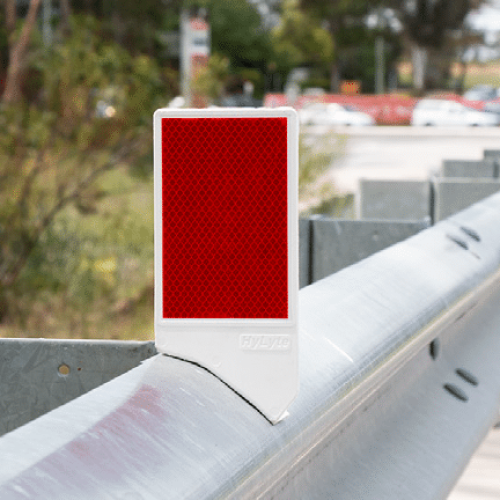 Joint10 in situ Red and white guardrail delineators